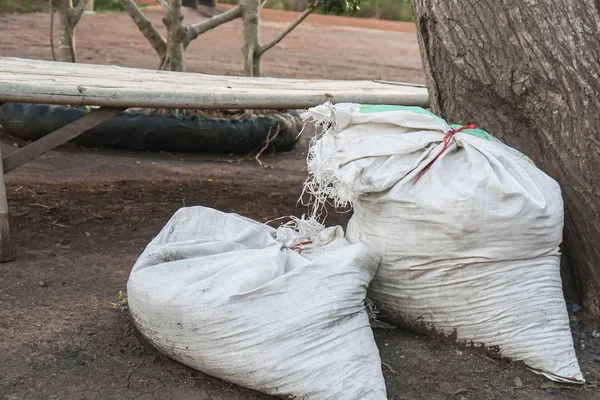 close up soil and fertilizer in white sack bags