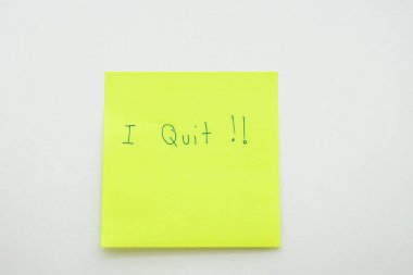 business situation concept of resignation in office - isolated I quit message on postit paper in workplace