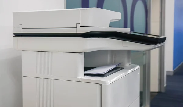 multifunctional office printer for in scanning printing documents at workplace