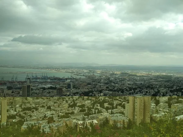 City by the sea. Overcast skies. Rainy clouds. Haifa