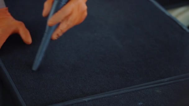 Man cleans car interior with vacuum cleaner — Stock Video