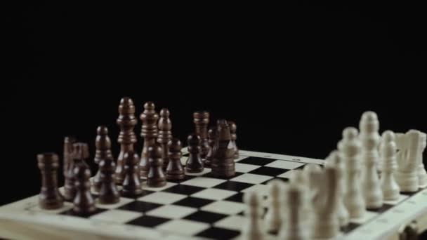 Chess game on black background close up — Stock Video