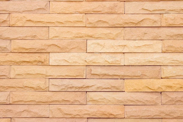 Seamless Natural pattern of decorative brick sandstone wall surface with concrete of modern style design decorative uneven have cracked realmasonry wall of multicolored stones or blocks with cement.
