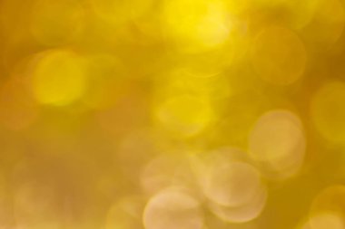 Soyut altın Bokeh yumuşak arka plan bulanık doğa bulanık ışıkla parıldayan vintage tarzı sıcak pastel parti ve serin renkli ufuk daire soluk. Tatil kartı için parlak kopya alanı. 