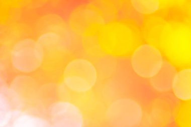 Soyut Turuncu Bokeh yumuşak arka plan bulanık doğa bulanık ışıkla parıldayan vintage tarzı sıcak pastel parti ve serin renkli ufuk daire soluk. Tatil kartı için parlak kopya alanı. 