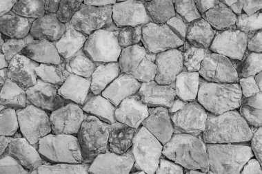 Dikişsiz beyaz desen dekoratif gri kayrak taş duvar yüzeyi çok renkli taşlar veya çimento veya kumtaşı blokları modern tarzı tasarım dekoratif düzensiz kırık realmasonry duvarına.