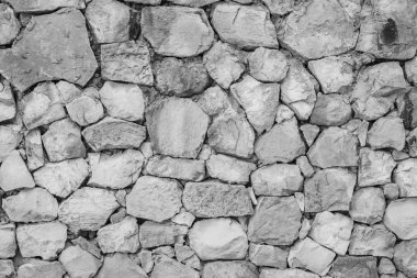 Dikişsiz beyaz desen Dekoratif gri kayrak taş duvar yüzeyi çok renkli taşlar veya çimento veya kumtaşı blokları modern tarzı tasarım dekoratif düzensiz kırık realmasonry duvarına.