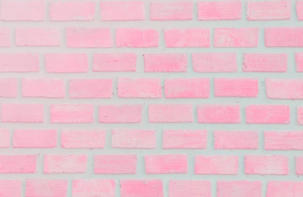 Wall stained old grungy stucco texture background. Brickwork flooring interior rock old pattern clean concrete have grid uneven design stack. Abstract kitchen wallpaper modern pink pastel brick tile.