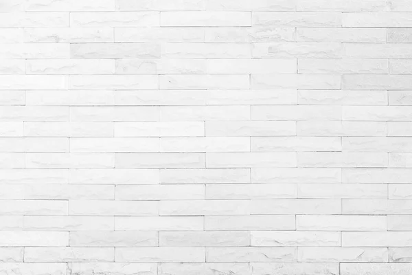 Seamless White pattern of decorative brick sandstone wall surface with concrete of modern style design decorative uneven have cracked realmasonry wall of multicolored stones or blocks white cement.