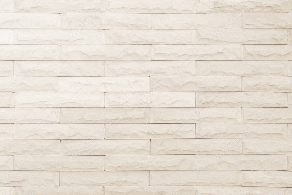 Seamless Cream pattern of decorative brick sandstone wall surface with concrete of modern style design decorative uneven have cracked realmasonry wall of multicolored stones or blocks white cement.