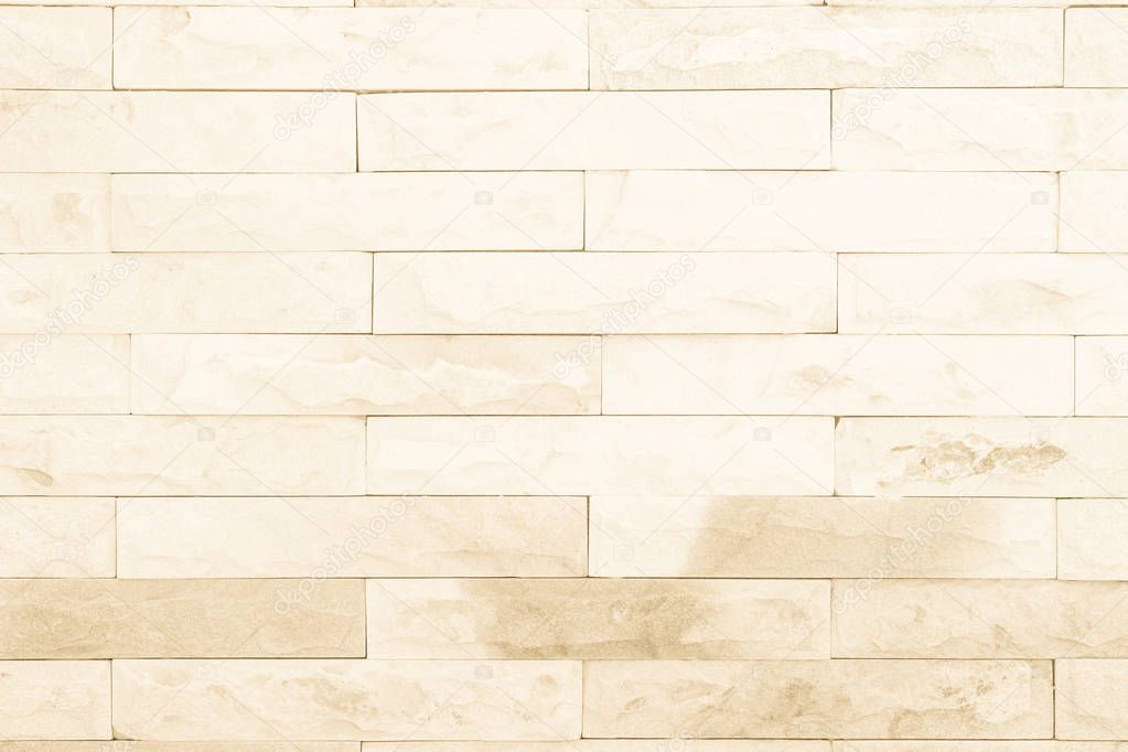 Seamless Cream pattern of decorative brick sandstone wall surface with concrete of modern style design decorative uneven have cracked realmasonry wall of multicolored stones or blocks white cement.