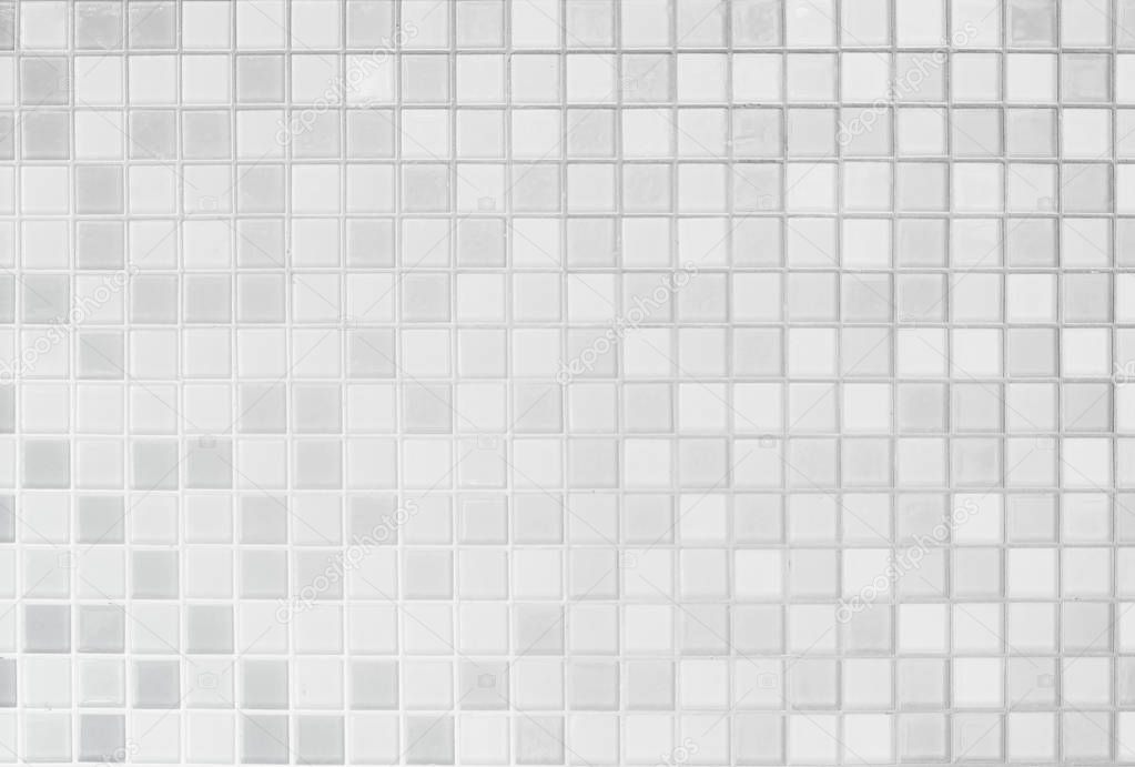 White or gray ceramic wall and floor tiles abstract background.