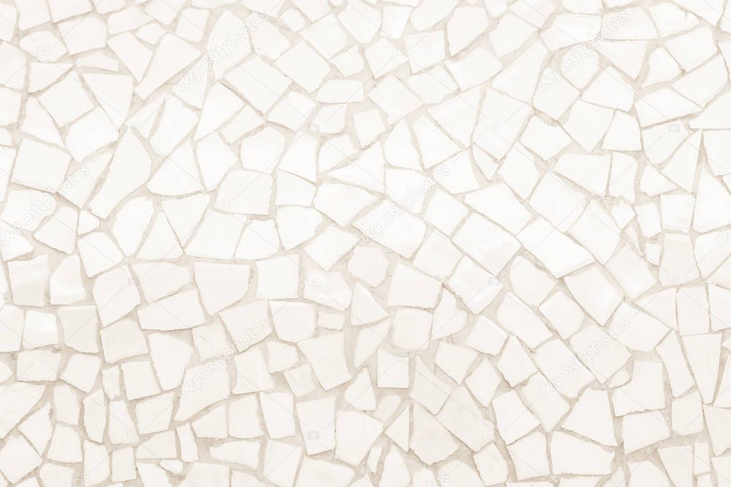 Broken tiles mosaic seamless pattern. Cream tile real wall high resolution real photo or brick seamless with texture interior background. Abstract wallpaper irregular in bathroom.