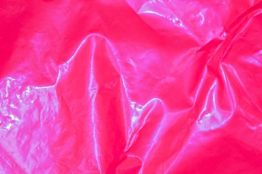 Duvar yüzeyinin plastik dokusu. Üst görüntüde pembe şekilli soyut bir arkaplan. Kopyalama alanı olan plastik kabataslak yüzey.