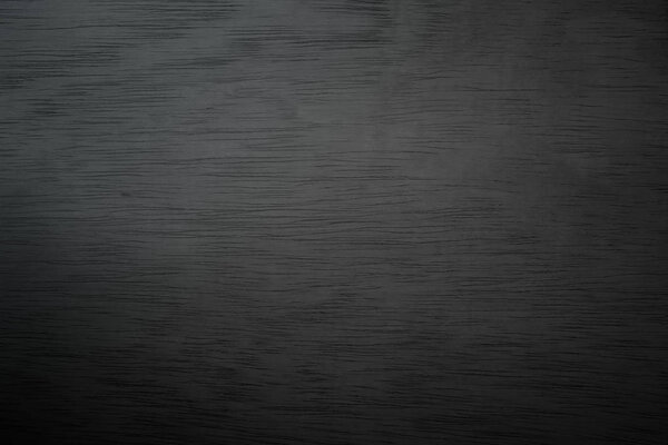 Abstract vignette black wood texture high quality close up. Dark furniture plank material wallpaper. Blank grunge wooden grain surface be used design as background or board luxury floor copy space.