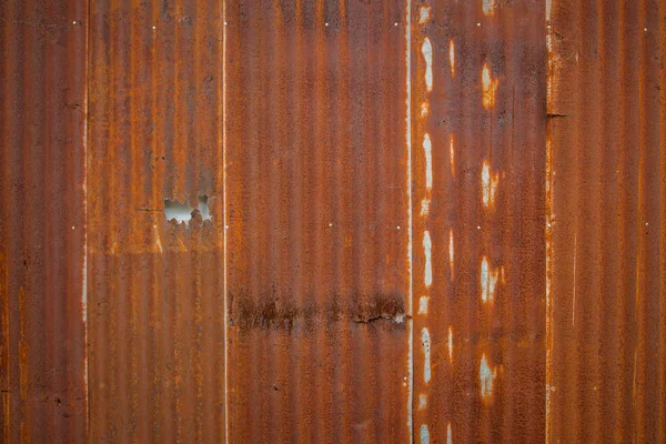 Old Zinc rust texture background, close up to pattern texture vertical zinc sheet. Abstract  Image of Rusty corrugated metal vintage background view. Wall steel older dirty grunge surface fence house.