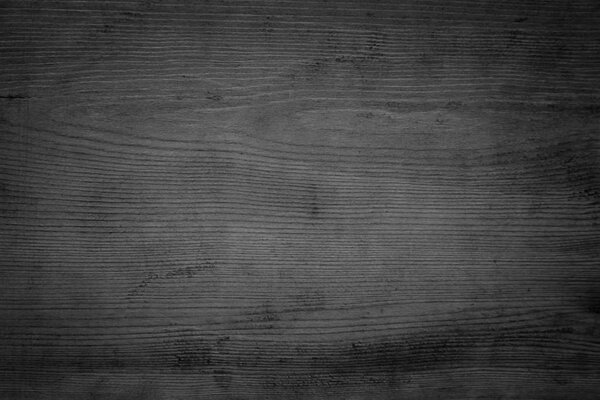 Abstract vignette black wood texture high quality close up. Dark furniture plank material wallpaper. Blank grunge wooden grain surface be used design as background or board luxury floor copy space.