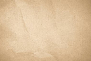 Arka plan olarak Kahverengi geri dönüştürülmüş zanaat kağıt dokusu. Krem kağıt doku, Eski vintage sayfa veya grunge vinyet. Desen kaba sanat grunge mektup buruşturulmuş. Metin için kopyalama alanı olan hardboard.