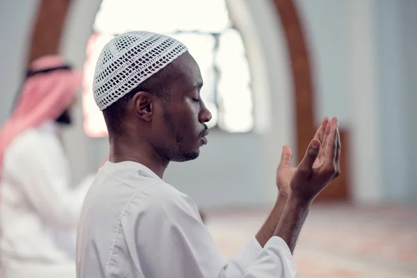 Two religious muslim man praying together inside the mosque — Stock Photo, Image