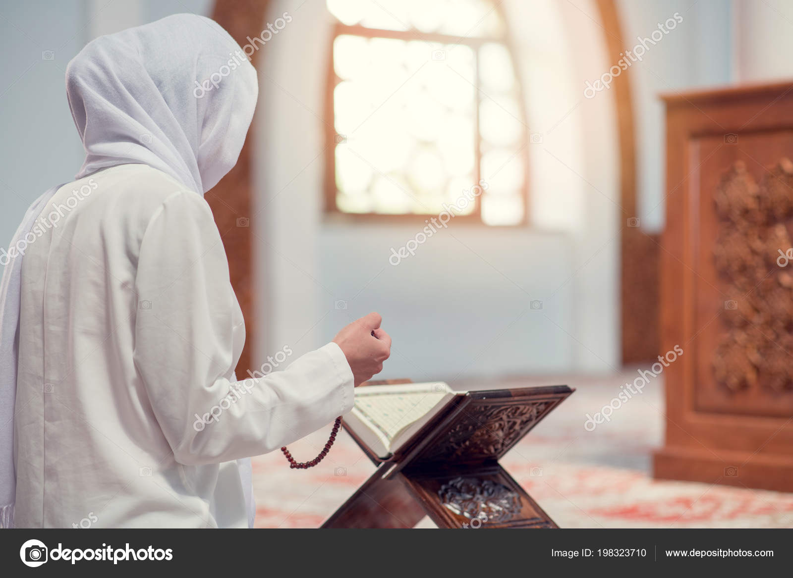 Young beautiful Muslim Woman Praying In Mosque Stock Photo by ©FS-Stock