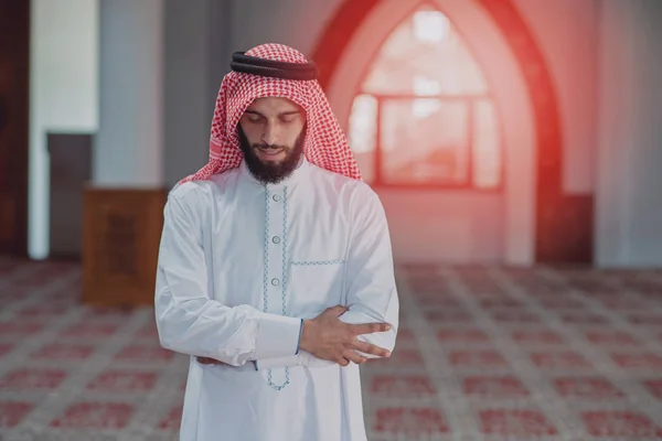 Religious muslim man praying inside the mosque