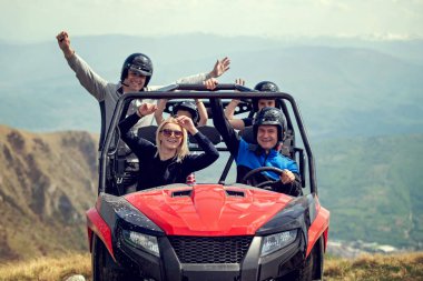 Friends driving off-road with quad bike or ATV and UTV vehicles clipart