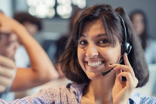 Beautiful phone operator Arab woman working in modern startup office — Stock Photo, Image