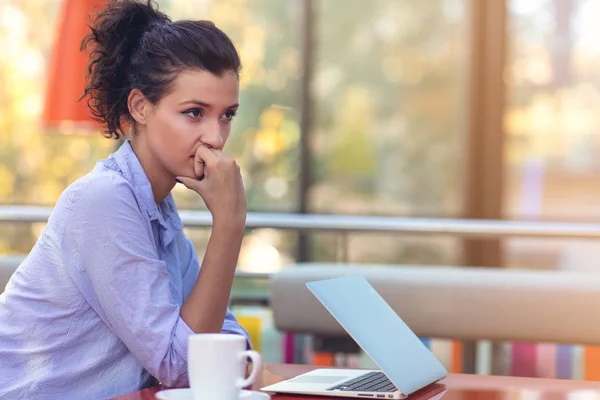 Stressed hipster businesswoman working on laptop in her office — Stock Photo, Image