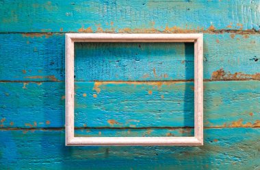Fotoğraf ve resim mavi dokulu ahşap arka plan üzerinde beyaz renk için boş bir çerçeve