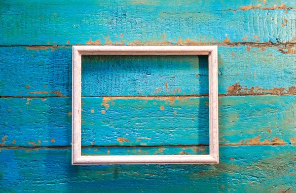 Fotoğraf ve resim mavi dokulu ahşap arka plan üzerinde beyaz renk için boş bir çerçeve