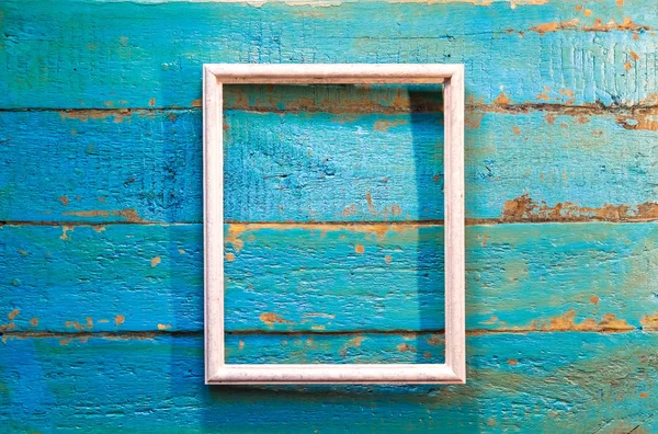 Fotoğraf ve resim mavi dokulu ahşap arka plan üzerinde beyaz renk için boş bir çerçeve