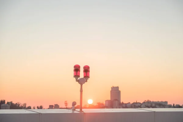 red lights on the roof of a high-rise building for the safety of buildings and air transport