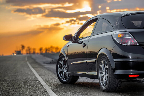 Beautiful Black Modern Car Stands Asphalt Road Summer Illuminated Rays — Stock Photo, Image