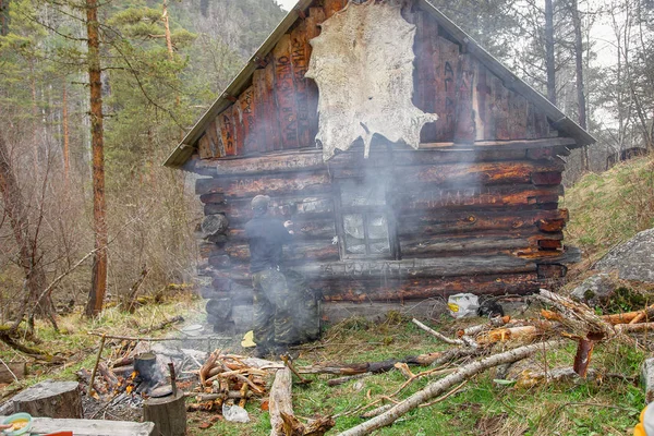 lonely old wooden hut high in the mountains surrounded by coniferous forests, Teberda, Dombay Karachay-Cherkess Republic