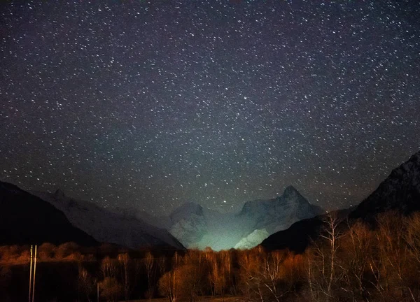 Dombay mountains at night under a starry sky, Karachay-Cherkessia Russia