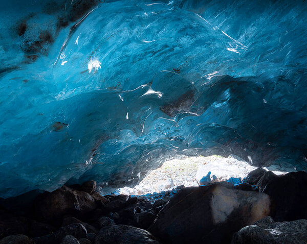 ice cave inside the Alibek mountain glacier in Dombai, Caucasus