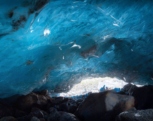 ice cave inside the Alibek mountain glacier in Dombai, Caucasus