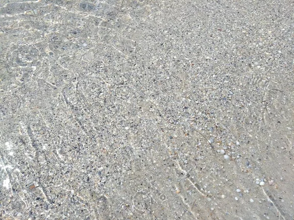 Plage de la mer avec eau, macro, vue sur le dessus — Photo