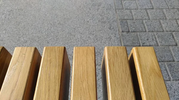 Texture of lacquered wood on a bench