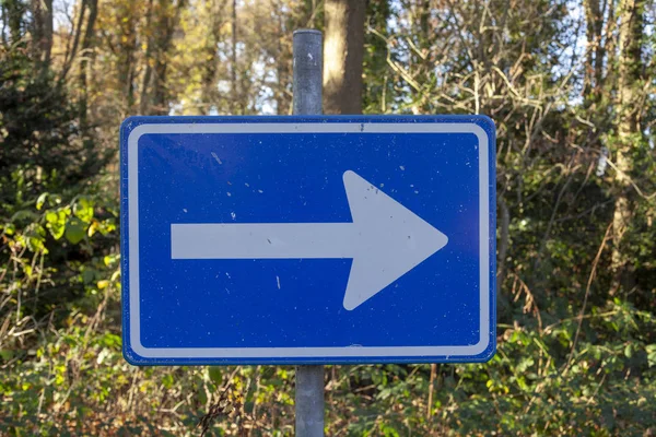 sign direction of traffic on the road