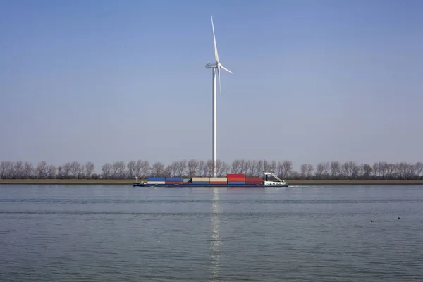 Netherlands, New Waterway. Container ship in front of modern win — Stock Photo, Image