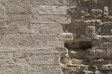 Eski sarı yıpranmış tuğla duvar parçası