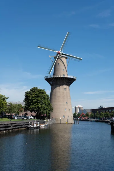 stock image SCHIEDAM, NETHERLANDS. The Nolet mill, the highest windmill of the world. It generates electricity for the adjacent distillery