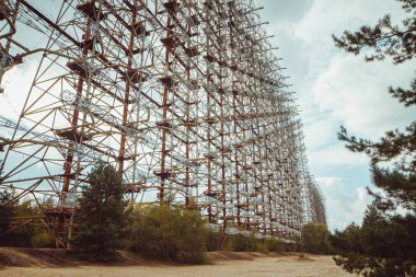 Duga - Soviet over-the-horizon OTH radar system. Duga-3 Russian Woodpecker - antenna complex, military object of USSR ABM. Chernobyl Exclusion Zone, Pripyat, Ukraine clipart