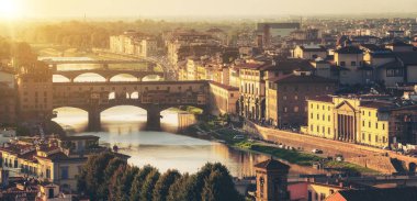 Florence Ponte Vecchio Bridge and City Skyline in Italy. Florence is capital city of the Tuscany region of central Italy. Florence was center of Italy medieval trade and wealthiest cities of past era. clipart