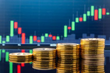 Borsa yatırım ve ticaret kavramı - borsa fiyat tablosu içinde geçmiş ile altın metal paralar.