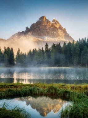 Majestic landscape of Antorno lake with famous Dolomites mountain peak of Tre Cime di Lavaredo in background in Eastern Dolomites, Italy Europe. Beautiful nature scenery and scenic travel destination. clipart