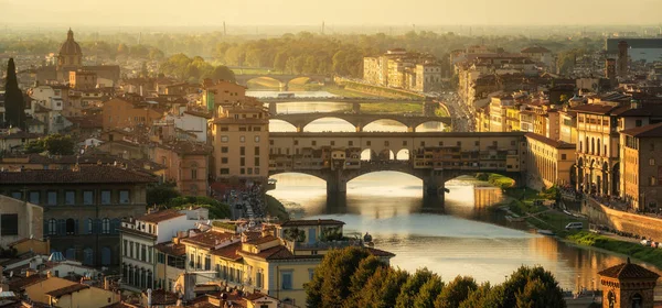 Florence Ponte Vecchio Bridge and City Skyline in Italy. Florence is capital city of the Tuscany region of central Italy. Florence was center of Italy medieval trade and wealthiest cities of past era.