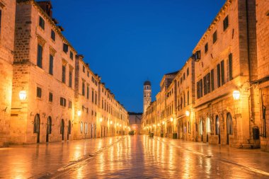 Historic street of Stradun (Placa) in old town of Dubrovnik in Croatia at night - Prominent travel destination of Croatia. Dubrovnik old town was listed as UNESCO World Heritage in 1979. clipart