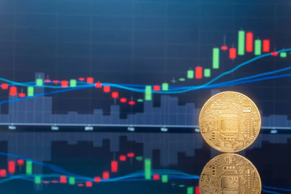 Initial coin offering (ICO) and digital money investing concept - Physical metal digital coins with blue global trading exchange market price chart in the background.